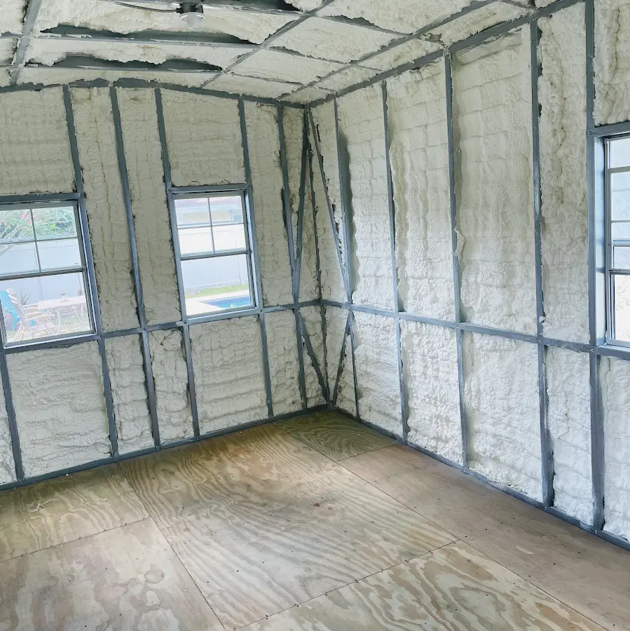 Closed-cell spray foam insulation applied to wall cavities in a residential project in Millis